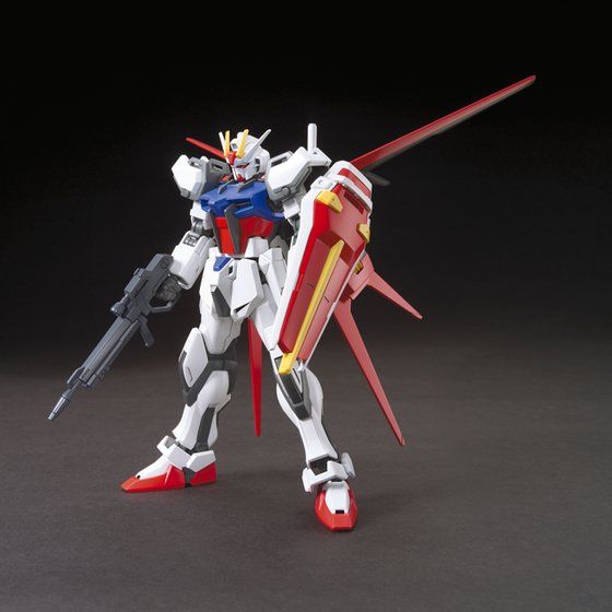 Model kit of a robot with red, white, and blue colors on a dark background