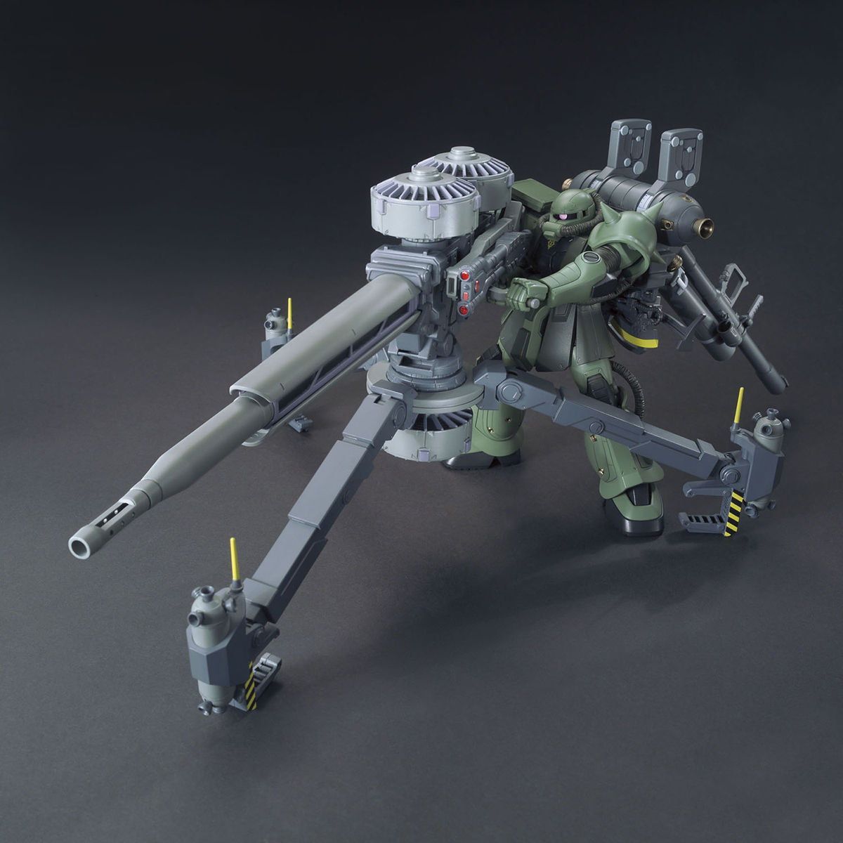 Toy robot with large weapon on a dark background