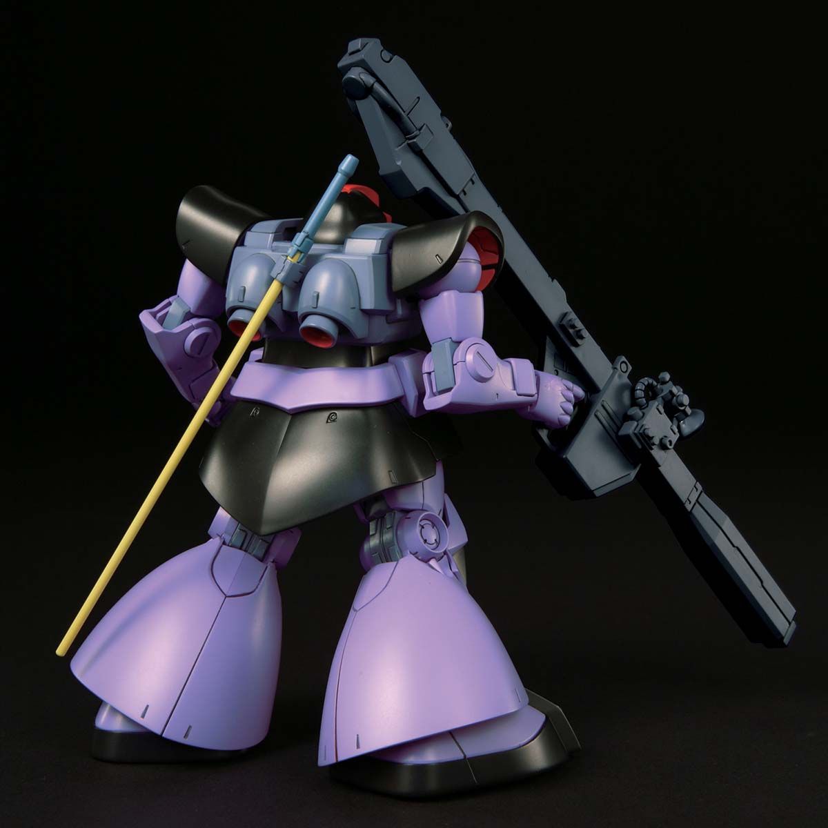 Mechanical robot figure with purple and black design on a black background