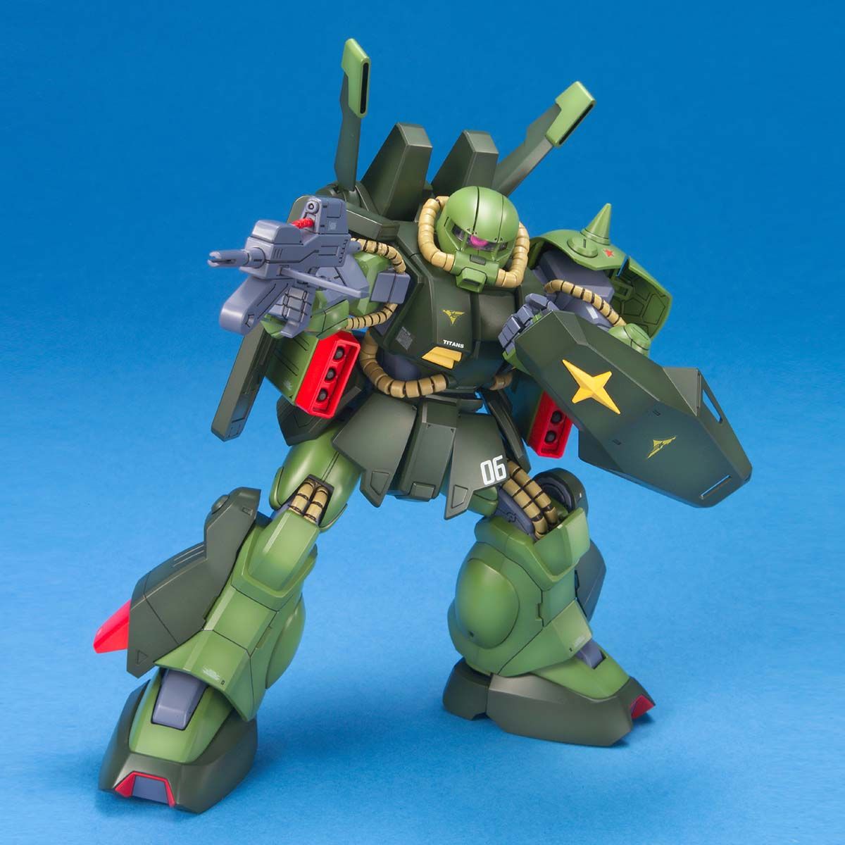 Green robot model with star emblem on a blue background
