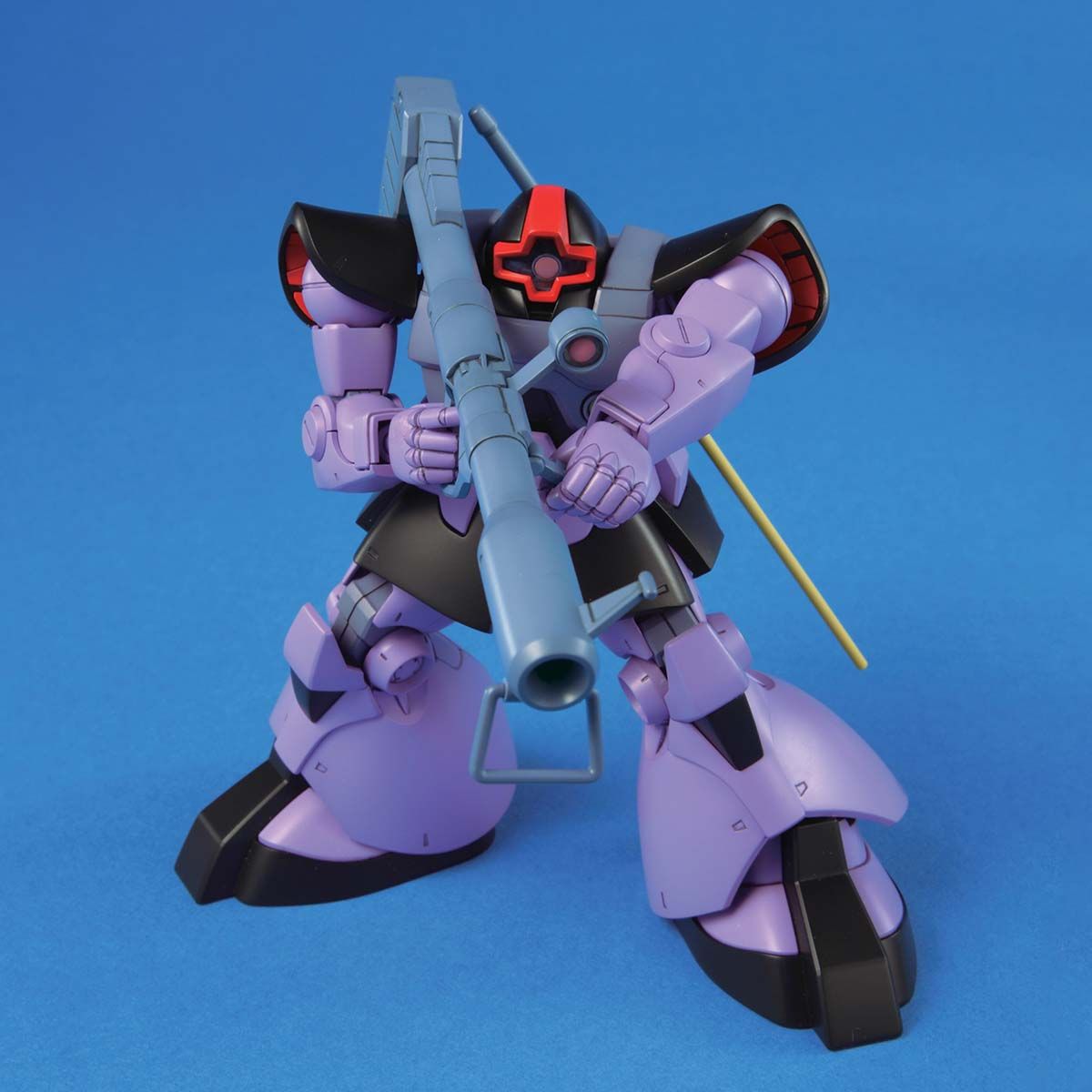 Model kit of a robot with purple and black color scheme on a blue background