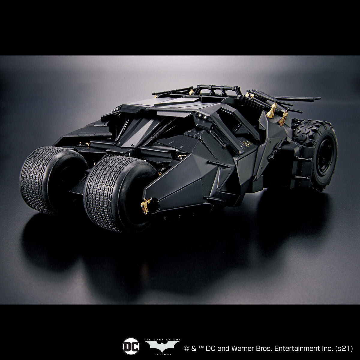 Black Batmobile model on a dark background with DC logo.