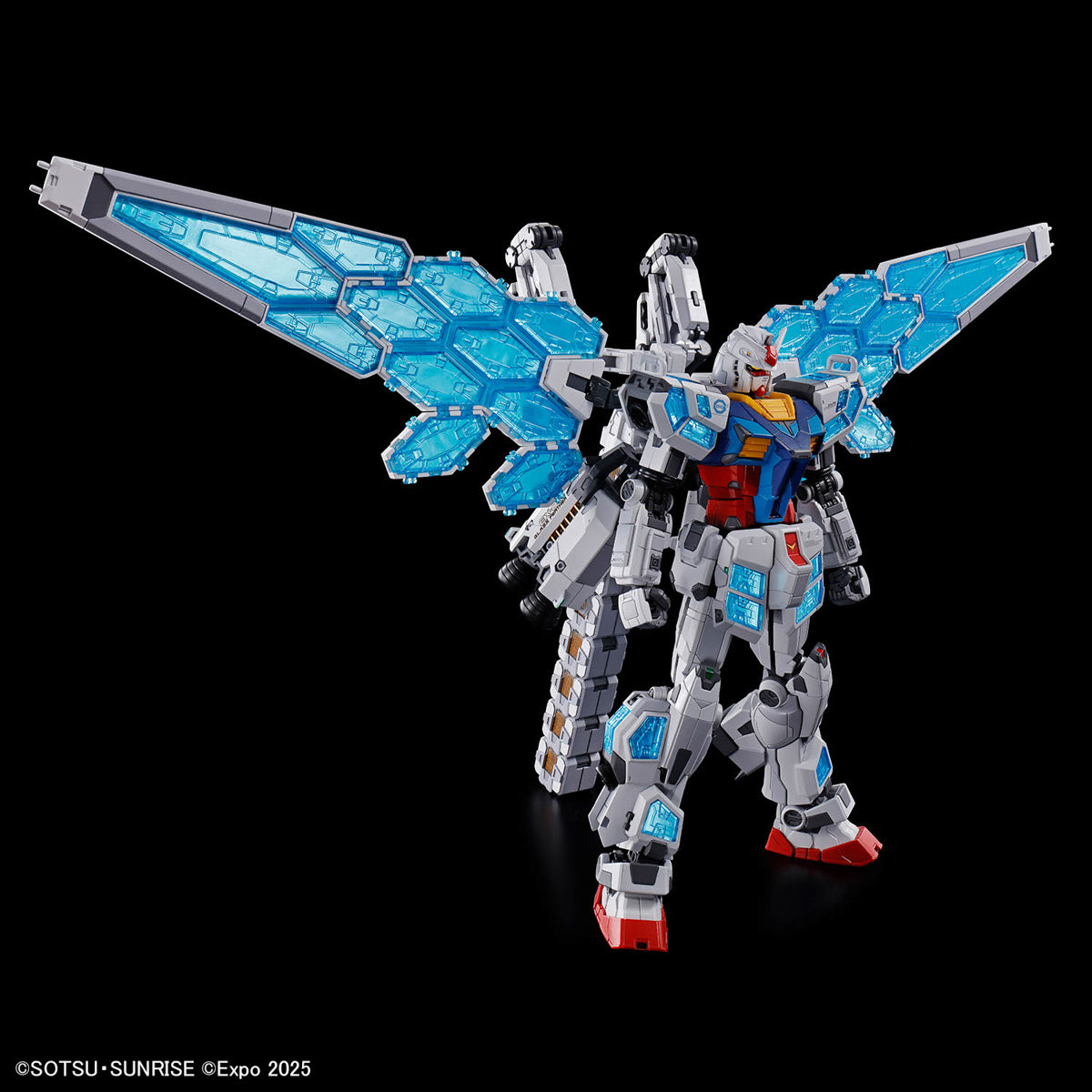 Model kit of a robot with blue and gray wings on a black background