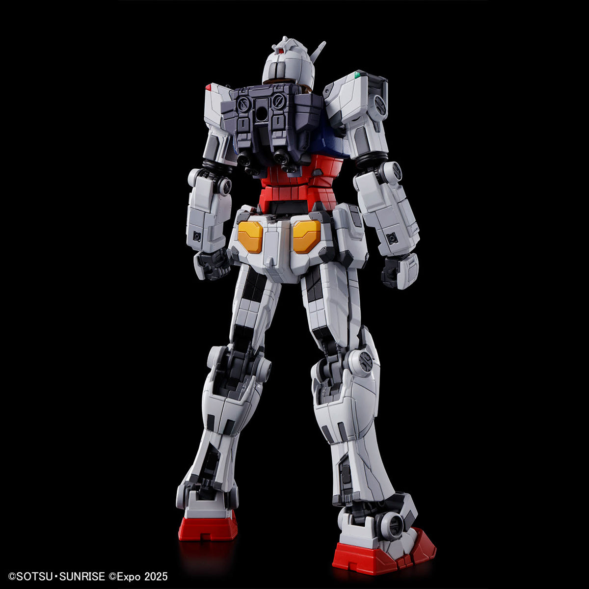 Toy robot model on a black background