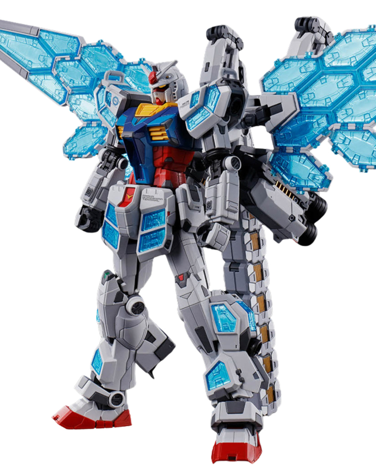 A detailed Gundam-style mecha toy figure in a dynamic pose, featuring a gray body with red, blue, and yellow accents, translucent light blue wing-like panels, and red feet, shown on a plain white background.