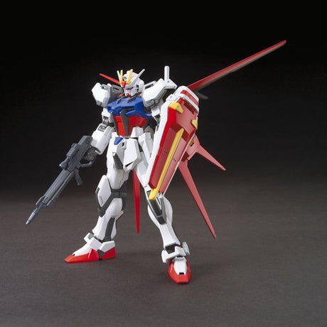 Model kit of a robot with red, white, and blue colors on a dark background