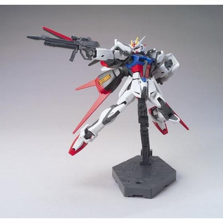 Model kit of a robot with red, white, and blue colors on a gray background