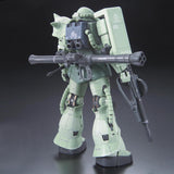 Model kit of a green robot with large weapon on a dark background