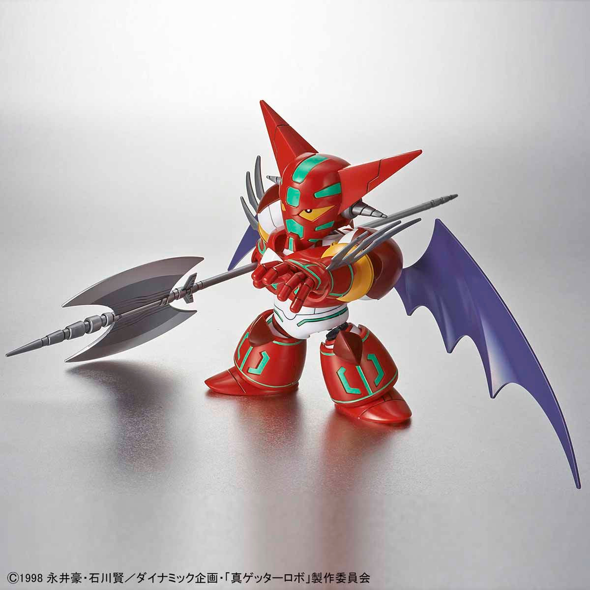 Toy figure with red and purple design on a reflective surface