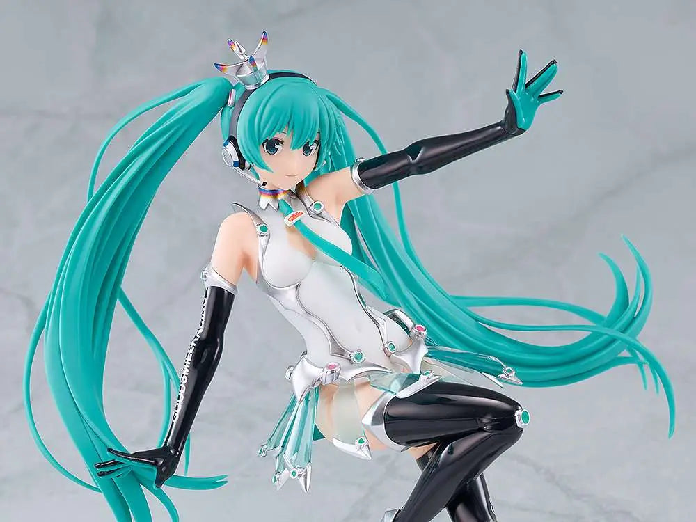 Anime character figurine with teal hair and black boots on a gray background