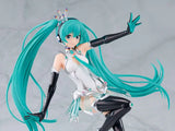 Anime character figurine with teal hair and black boots on a gray background