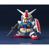 Model kit of a robot with red, white, and blue colors on a dark background.
