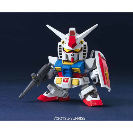 Model kit of a robot with red, white, and blue colors on a dark background.