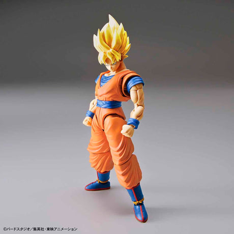 Action figure of a character in an orange and blue outfit on a gray background
