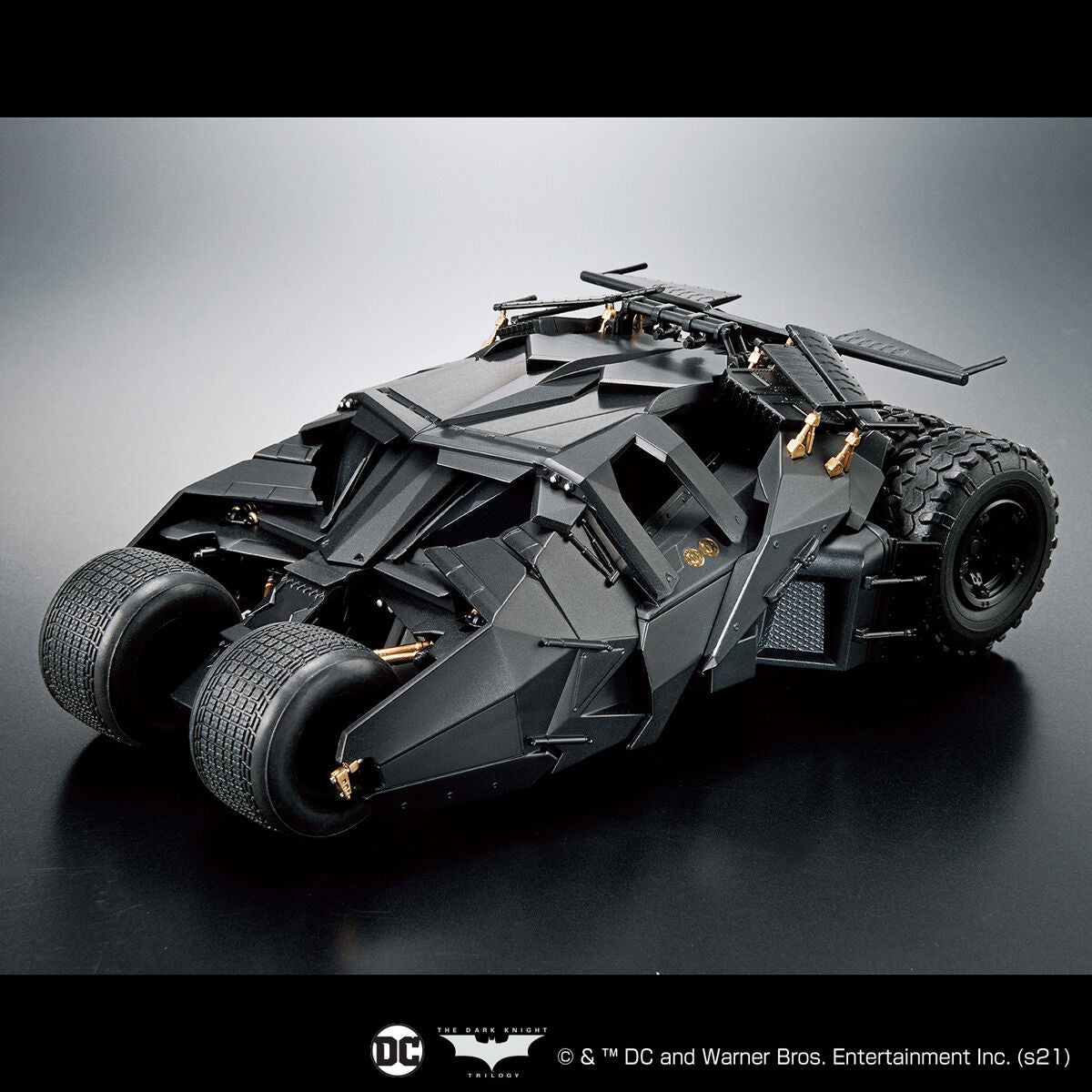 Model of the Batmobile on a reflective surface with a dark background