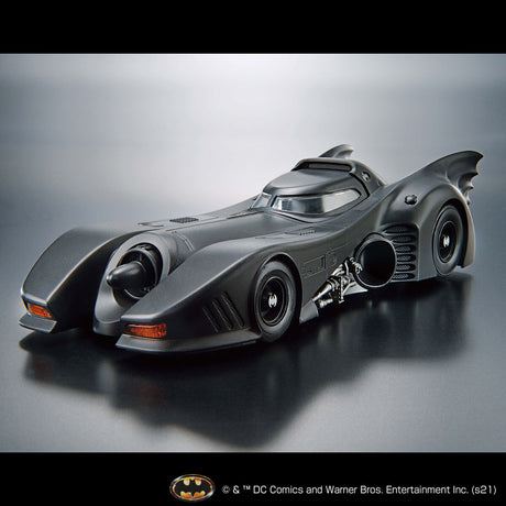 Model of the Batmobile on a reflective surface with a gray background