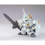 Model kit of a robot with white, gold, and black design on a gray background