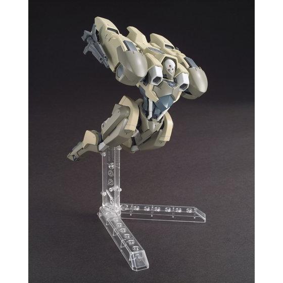 Mechanical model on a clear stand against a dark background