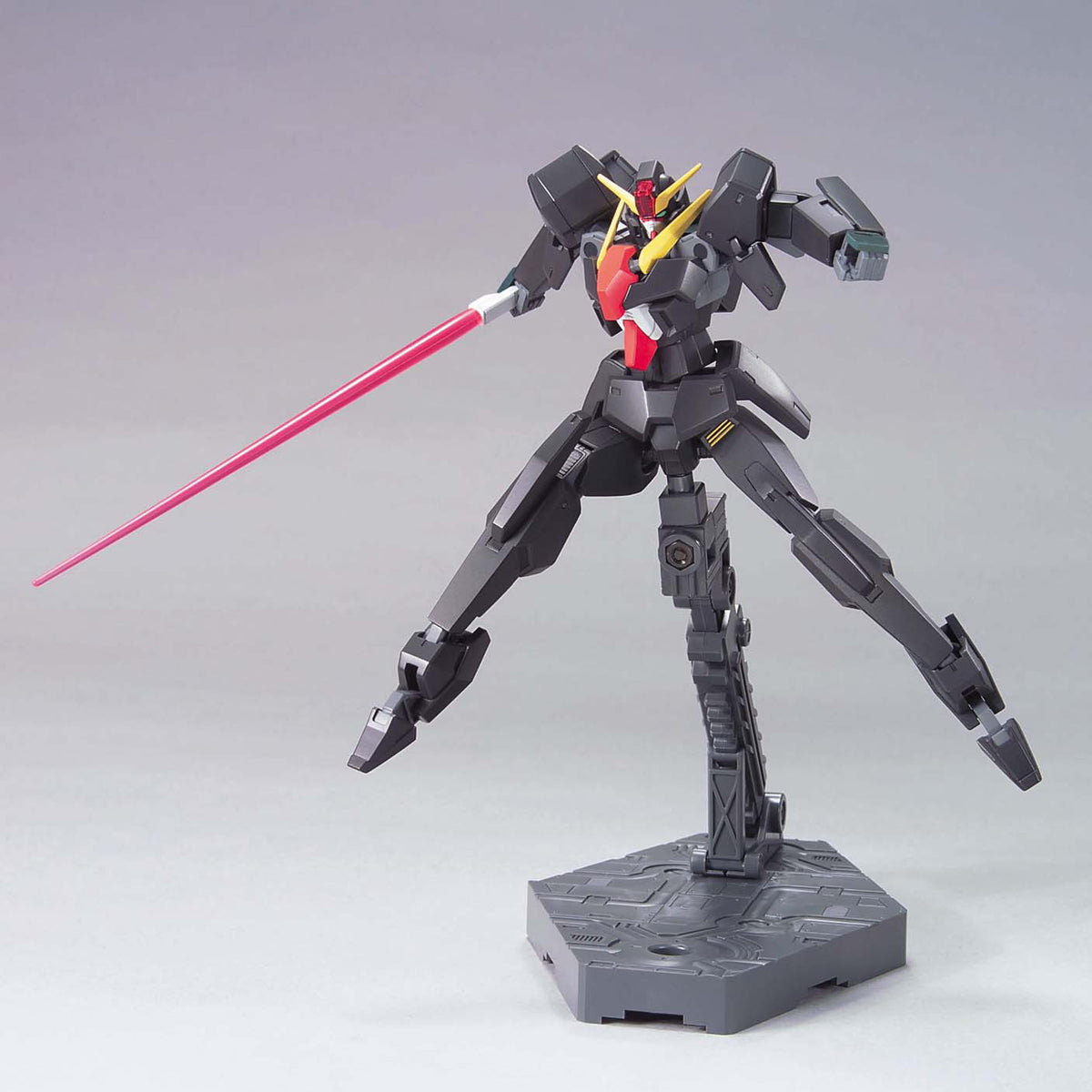 Model kit of a robot with a red sword on a gray background