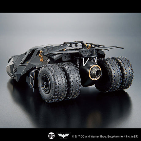 Model of a Batmobile on a reflective surface with a gray background