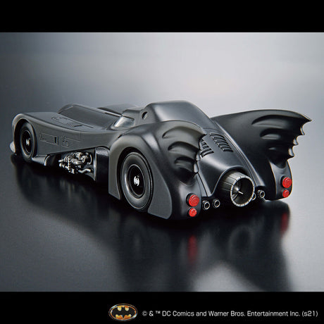 Model of the Batmobile on a reflective surface with a gray background