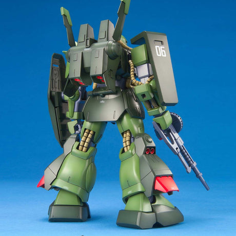 Model kit of a green and gray robot on a blue background