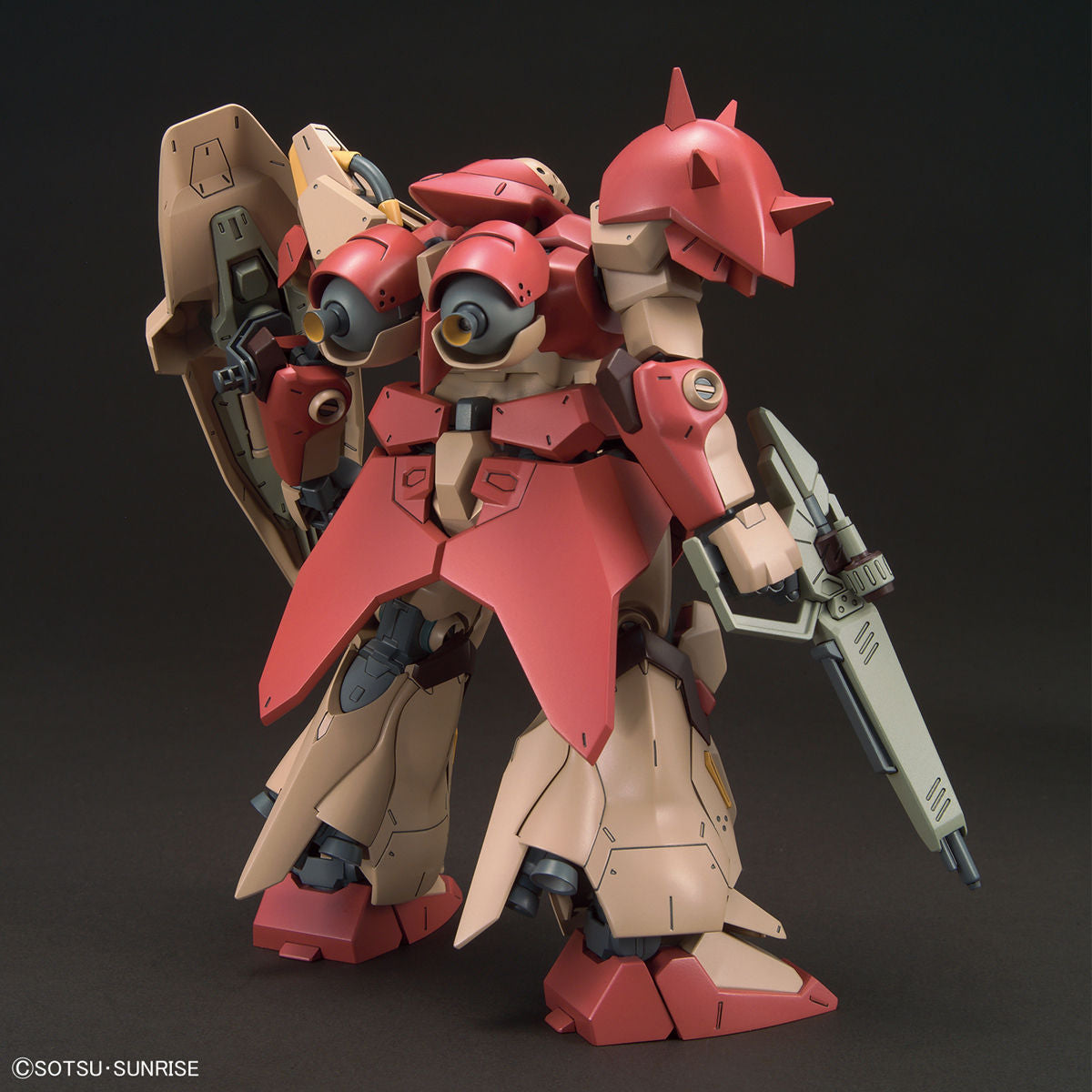 Model kit of a red and beige robot with a dark background