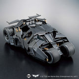 Model of a Batmobile on a reflective surface with a gray background