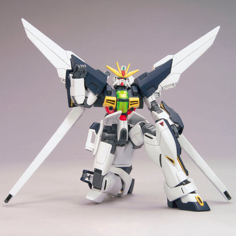 Model kit of a robot with white, black, and green colors on a gray background