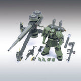 Model kit of a green robot with various parts on a gray background