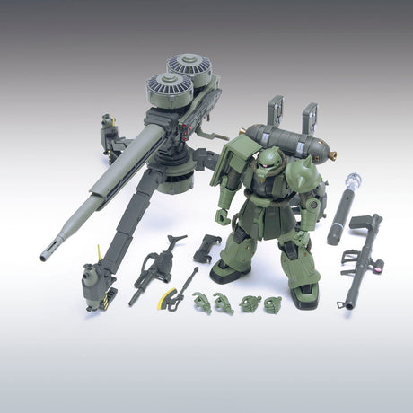 Model kit of a green robot with various parts on a gray background