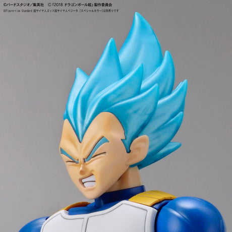 Super Saiyan Blue character figure with blue hair and white outfit on gray background