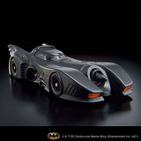Gray Batmobile model on a black background with DC Comics logo.
