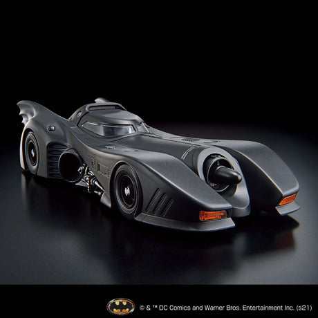Gray Batmobile model on a black background with DC Comics logo.