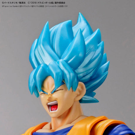 Figure with blue hair and orange outfit on a gray background
