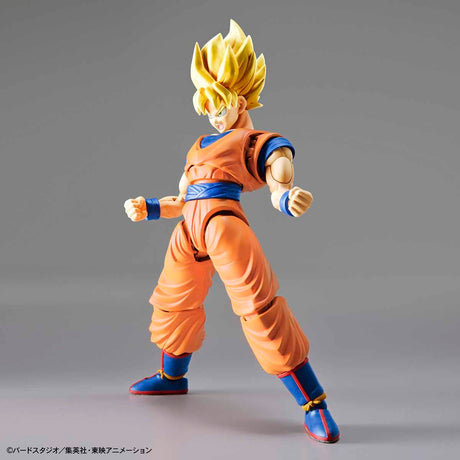 Action figure in orange and blue outfit on a gray background