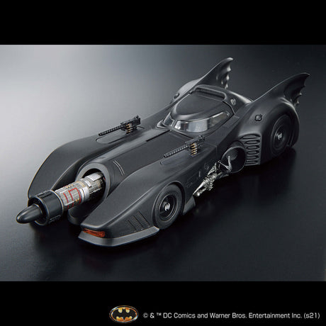 Model of the Batmobile on a reflective surface with a dark background