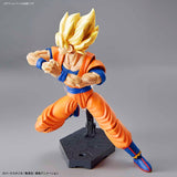 Action figure of a character in orange and blue outfit on a gray background