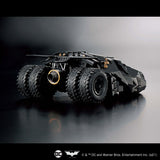 Toy model of the Batmobile on a reflective surface with a dark background