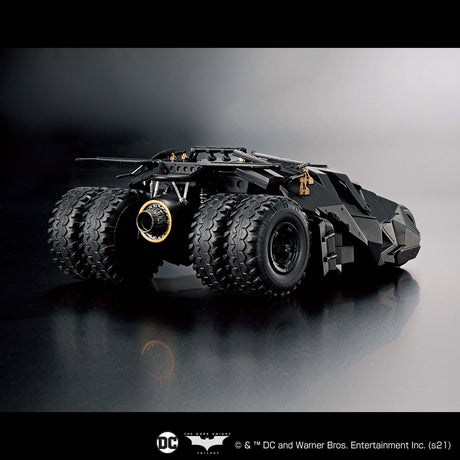 Toy model of the Batmobile on a reflective surface with a dark background