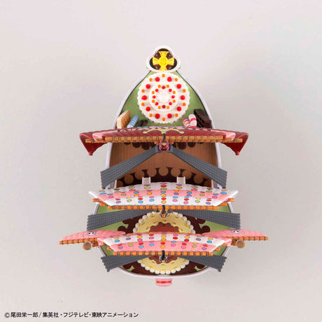 Three-tiered decorative stand with colorful design on a white background