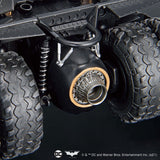 Close-up of a vehicle suspension system with visible branding on a dark background