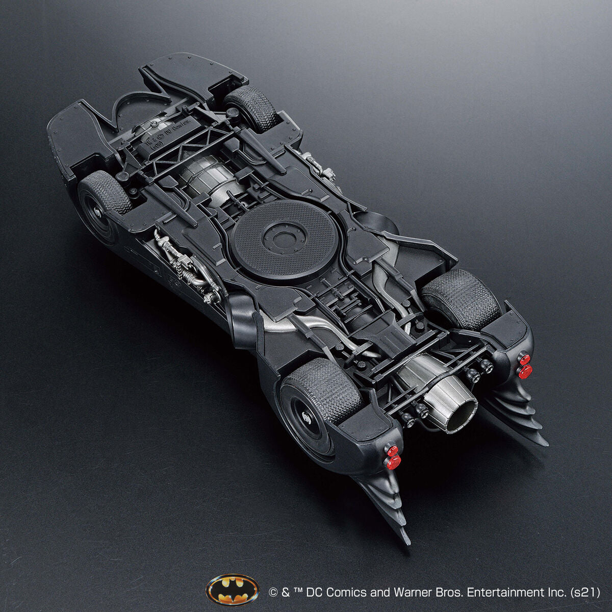 Model of a Batmobile on a dark background with DC Comics logo.