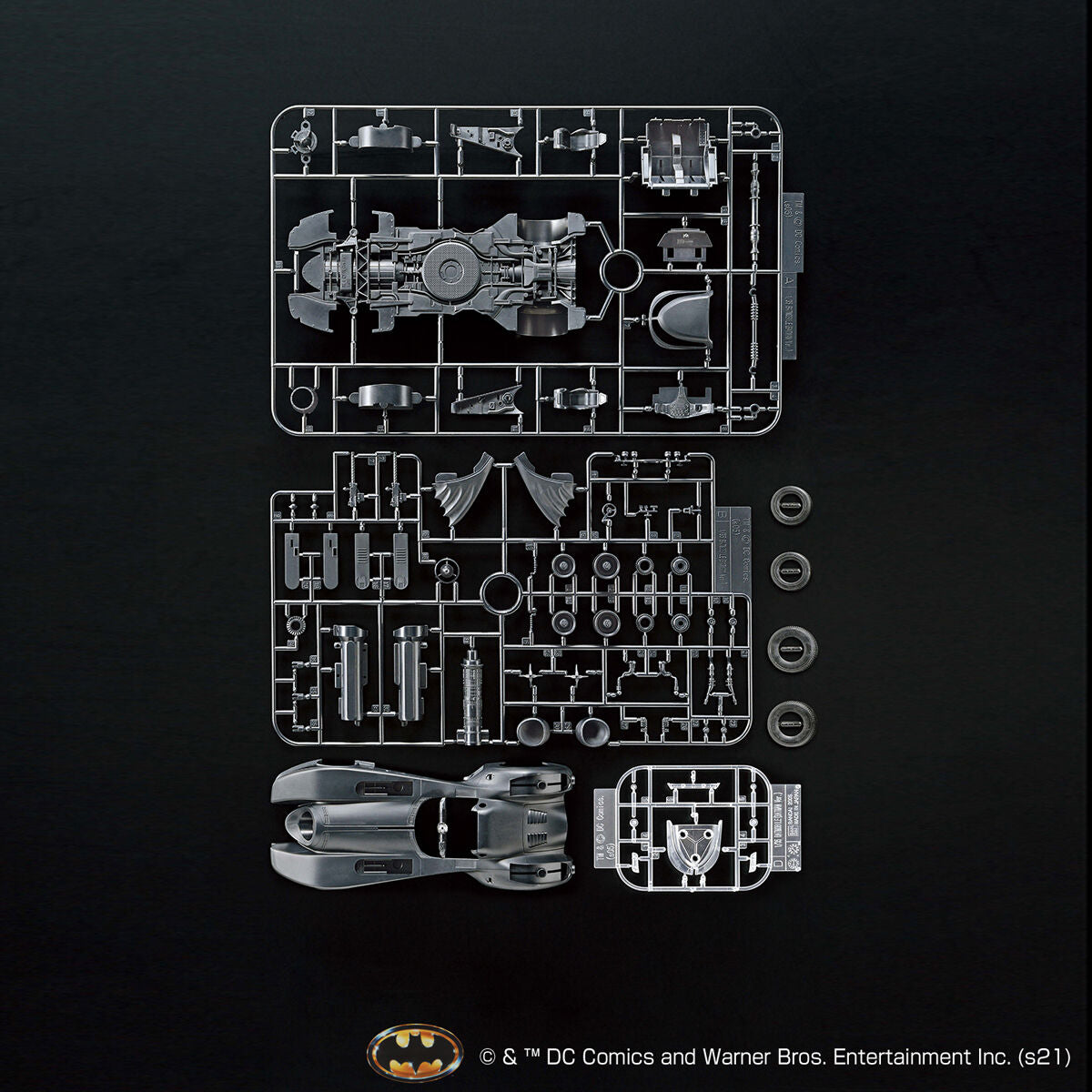 Batman toy figure parts on a black background with DC Comics logo.