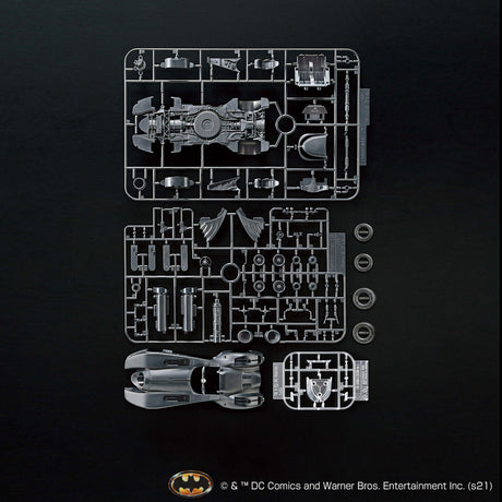 Batman toy figure parts on a black background with DC Comics logo.