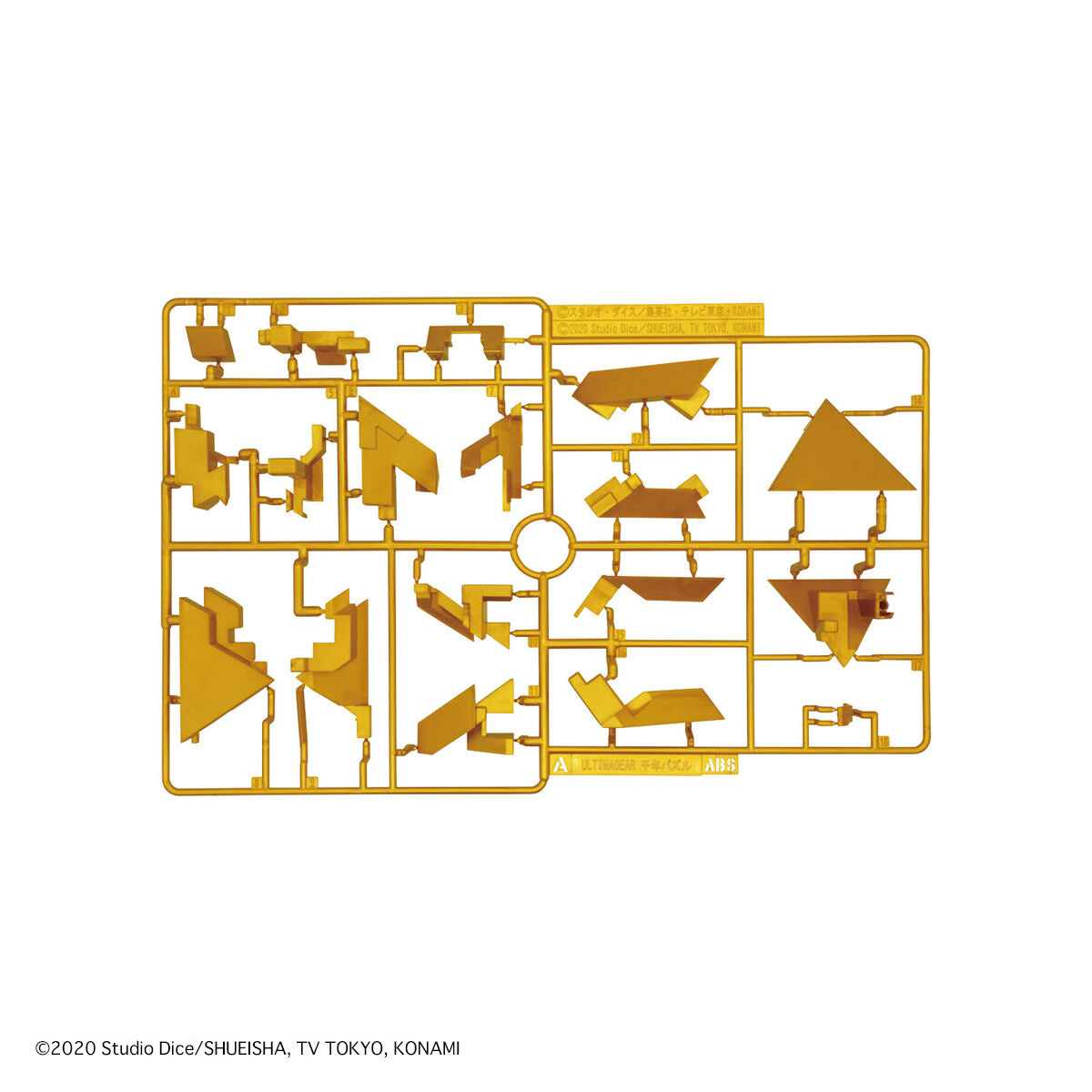 Gold-colored model kit piece on a white background