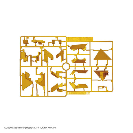 Gold-colored model kit piece on a white background