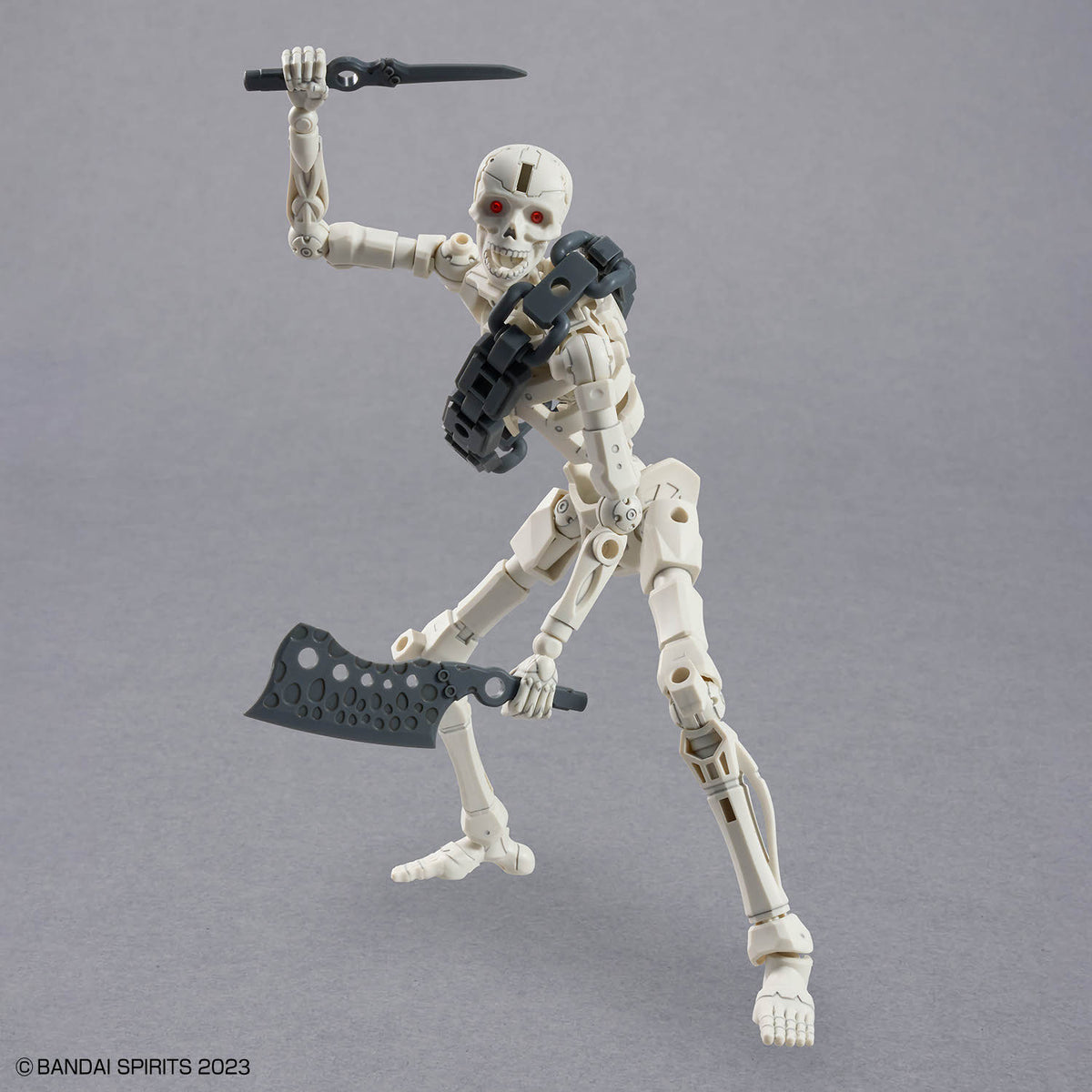 Mechanical skeleton figure with weapons on a gray background