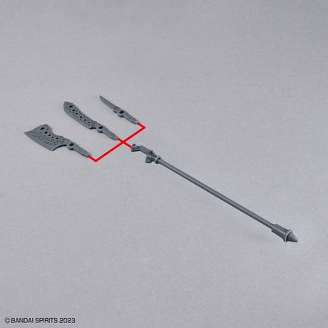 Model kit of a weapon with parts on a gray background, featuring Bandai Spirits branding.
