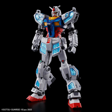 Robot model toy with gray, blue, and red color scheme on a black background